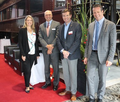 Carrie Evans, VP Sales and Marketing, Iowa Interstate Railroad, far left, joins CP's Chief Marketing Officer John Brooks, Joe Parsons, GM Iowa Interstate Railroad and CP's VP of Market Strategy and Asset Management Mike Foran, far right, for a photo during  the CP Reconnect 2018 Short Line and Regional Railroad  Conference in Calgary. Sept. 10, 2018. (CNW Group/Canadian Pacific)