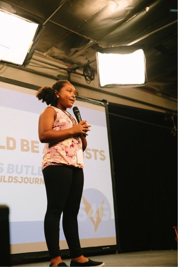 Genesis Butler, aged 11, addresses participants at the first ever Dairy Free Athlete Summit in Los Angeles, CA. Ms. Butler, popular vegan activist and public speaker, is the youngest person ever to give a TedX Talk. Credit: Alexandra Foley, Switch4Good.