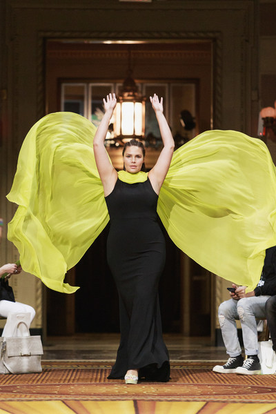 Candice Huffine makes a dramatic entrance at the Christian Siriano show wearing limited-edition, direct from runway platforms from the Payless collection.