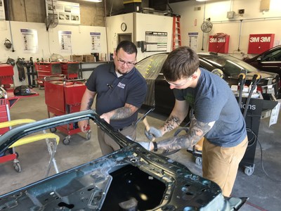 A Caliber Collision trainer works with a Ft. Bragg soldier at Caliber's Changing Lanes Academy in Fayetteville, NC. Classes for Ft. Carson soldiers start every seven weeks at the new Caliber Collision Falcon Academy.