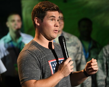 USO tour veteran and actor-comedian Adam Devine cuts it up with the crowd at the World’s Biggest USO Tour, a live entertainment experience at The Anthem in Washington, D.C., Sept. 12, 2018, bringing the USO mission to life and paying tribute to service members around the world. USO photo.