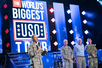 General David Goldfein, Chief of Staff of the Air Force engages with the audience before the concert. Live-looks into three remote USO locations – USO Camp Arifjan in Kuwait, USO Yokosuka in Japan, and USO Alaska Joint Base Elmendorf Richardson –  were led by General Paul Selva, Vice Chairman of the Joint Chiefs of Staff, General David Goldfein, Chief of Staff of the U.S. Air Force, General George William Casey, Jr., USA (ret.). USO photo by Cherie Cullen.
