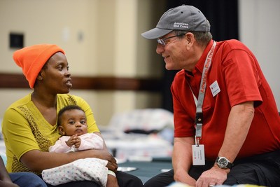Nyasa has been a resident of nearby New Bern, North Carolina for over a year. She evacuated with her three-month-old daughter Michelle to the Red Cross shelter on the campus of the University of North Carolina – Chapel Hill. A Red Cross volunteer ensures she has all needed supplies for herself and young infant.