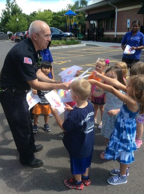 Kiddie Academy of Algonquin students deliver drawings to local firemen