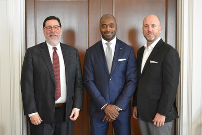 Pittsburgh Mayor William Peduto (left), Pro Football Hall of Famer Curtis Martin (middle), and Dan Towriss, CEO of Group1001 (right), gather in Pittsburgh.