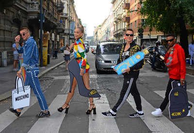 (L-R) River Viiperi, Jasmine Sanders (Golden Barbie), Jeremy Scott and WizKid stop traffic launching the CÎROC x Moschino collaboration during Milan Fashion Week in the centre (PRNewsfoto/Ciroc Vodka)
