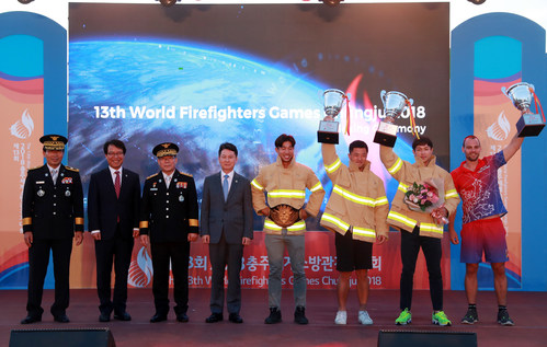 The winners of the 13th World Firefighters Games pose during an awards ceremony in Chungju, 147 km south of Seoul, on Sept. 17, 2018