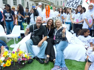 Bruce Mandel, Jen Soule and Patricia Strauch at the Lennon Bus's Come Together NYC residency kick-off event outside City Hall in New York. The John Lennon Educational Tour Bus is presented by OWC.