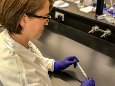 Dr. Bethany Henrick, Ph.D., Director of Immunology and Diagnostics for Evivo, holds prototype for first-ever point-of-care infant gut microbiome screening test