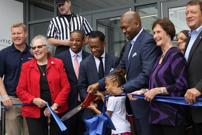 Co-founders Kendrick Ashton and Craig Dixon cut the ribbon on The St. James's flagship complex in Springfield, Virginia, with assistance from local leaders and family members.
