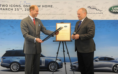 His Royal Highness, The Earl of Wessex (L), joins Jaguar Land Rover North America employees and Joe Eberhardt (R), President & CEO, Jaguar Land Rover North America, to unveil a special plaque and commemorate the official opening of the new headquarters.