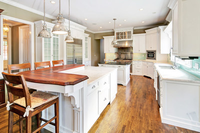 A light and bright kitchen includes top-quality appliances and dual islands for food preparation and service. More at NewJerseyLuxuryAuction.com.