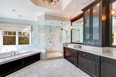 The master bath contrasts dark wood with light marble finishes, and offers a large soaking tub and oversized shower with two, multi-jet stations. More features at NewJerseyLuxuryAuction.com.