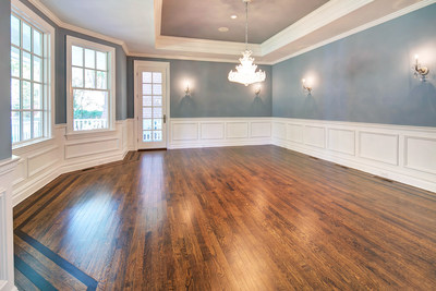 Large windows provide ample, natural light for many of the estate's common areas, such as the dining room, shown here. Discover more at NewJerseyLuxuryAuction.com.