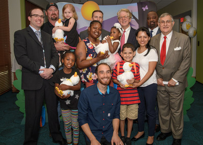 Aflac and Palmetto Health Children's Hospital introduce My Special Aflac Duck. L to R: Dr. Stuart Cramer, Aflac medical director, Palmetto Health Children's Hospital, patient Delilah Price (3), Rich Williams, chief distribution officer, Aflac, Dan Amos, Aflac CEO, Virgil Miller, chief operating officer, Aflac U.S., Samuel Tenenbaum, Pres.Palmetto Health Foundation, patient Trystan Jackson (3), patient Alexis McKay (7), Aaron Horowitz, inventor and Sproutel CEO, and patient Alexander Montes (8)