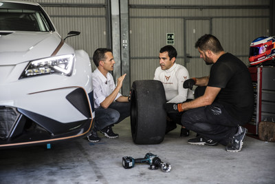 CUPRA team members next to the new e-Racer, the first fully electric touring race car (PRNewsfoto/CUPRA)