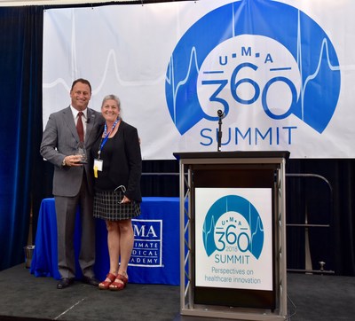 Ultimate Medical Academy Executive Chair and Former Governor of Massachusetts Jane Swift presents an Innovation Award to Tampa General Hospital President and CEO John Couris at the 360 Summit: Perspectives on Healthcare Innovation.