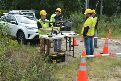 Pilots prepare for drone liftoff to obtain an aerial view of the PSEG Long Island electric transmission and distribution system.