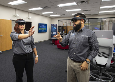 Melinda Anthony, information technology assistant, and AJ Tate, electrical engineer, engage with augmented reality at Lockheed Martin's Orlando Innovation Center. The facility, which opened today, empowers employees with the tools to develop new technology solutions.