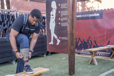 A member of the Music: Not Impossible team suits up at the fitting station on the Life Is Beautiful festival grounds.