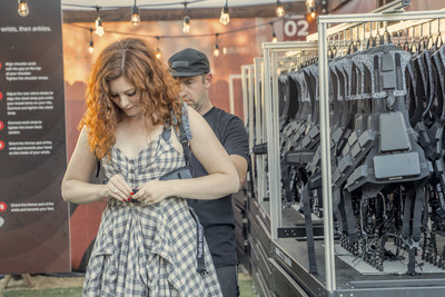 Singer songwriter Mandy Harvey, who happens to be deaf, is fitted with a Music: Not Impossible harness.