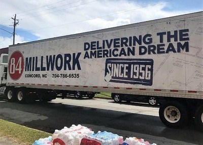 A tractor trailer donated by 84 Lumber drops off various necessities in New Bern, N.C.