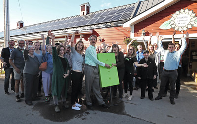 Patrons of the Wolfville Farmers' Market celebrate the launch of a 20 kW solar installation. (CNW Group/Bullfrog Power)