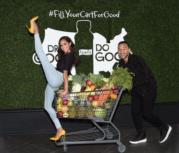 At the launch of Naked’s Drink Good Do Good campaign, John Legend and Misty Copeland show off their Shopping Cart dance helping communities in need. (PRNewsfoto/Naked)