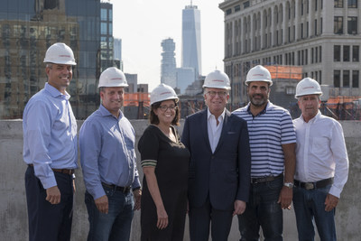 (Left to right) Lightstone’s Greg Iannacone, Mark Green, Meghan Bobertz, President Mitchell Hochberg, Chris Baxter and Bill Hickman, celebrate the topping out of Moxy East Village.