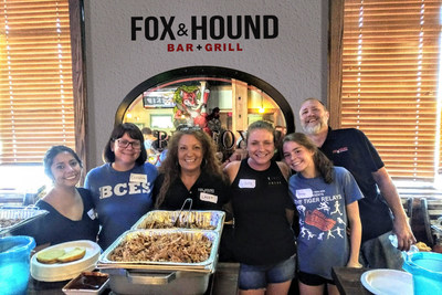 Laura Nealy (third from left) and Shawn Higham (far right) with volunteers get the buffet line set up.