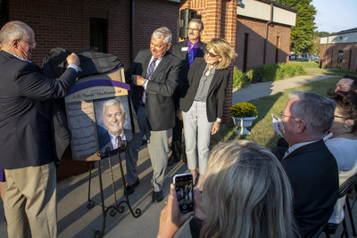 A plaque designating the new MacKinnon School of Business at Lincoln College is unveiled by (from left) David Clapp, President of the Board of Trustees and Sandy MacKinnon. Looking on are Dr. David Gerlach, President of Lincoln College, and MacKinnon's wife, Sandy. A plaque designating the new MacKinnon School of Business at Lincoln College is unveiled by (from left) David Clapp, President of the Board of Trustees and Sandy MacKinnon. Looking on are Dr. David Gerlach, President of Lincoln College, and MacKinnon's wife, Sandy.