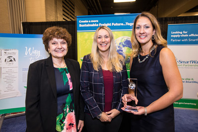Amanda Tolhurst (center), Director, U.S. Logistics for Whirlpool Corporation, and Kara Hegg (right), Manager, Transportation for Whirlpool Corporation stand with Cheryl Bynum (left), National Program Manager, SmartWay, after receiving the EPA SmartWay Excellence Award.