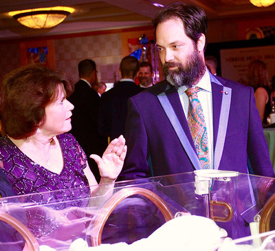 Sharon Kiernan, MD, neonatology, medical director, Neonatal Intensive Care Unit, Holy Cross Hospital, speaks with Jason Aufdem-Brinke, executive director and treasurer of The Nora Roberts Foundation prior to the formal announcement of the foundation's $250,000 gift to Holy Cross Health.