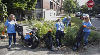 500 Gallagher employees mark 90,000 service-hours milestone by cleaning up streets in Chicago Cubs back yard.