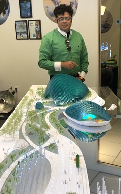 President and CEO, George Jacob with a model of the Bay Ecotarium