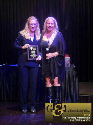 Melissa Aarskaug, VP of Business Development for Gaming Laboratories International (left), accepts the "Best Innovation” award for the company's Testing Automation from Gaming & Leisure publisher Jeannie Caruso.