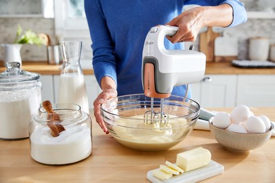 The Oster (r) Hand Mixer with HeatSoft Technology
