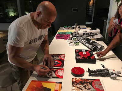 Bloodshot star Vin Diesel signs exclusive items for fourth annual Game4Paul fundraiser.