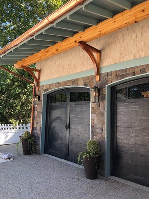 Installation of American Tradition Series carriage-style garage doors from Haas Door on the THIS OLD HOUSE(R)2018 IDEA HOUSE in Rhode Island. Photo courtesy of Sweenor Builders.