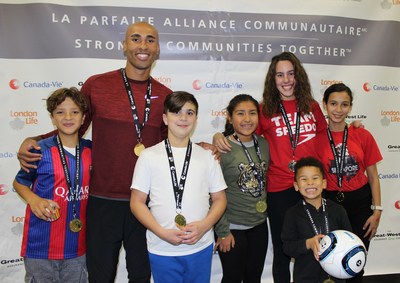 Damian Warner, Olympic decathlon athlete, and Aurlie Rivard, Paralympic swimming athlete, pose with children from Fondation Tremplin Sant. (CNW Group/The Great-West Life Assurance Company)