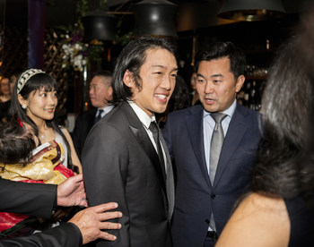 Crown Prince Andrew Lee, left, greets L.A. city and county officials, including L.A. Councilman David Ryu, right, at the Passing of the Sword ceremony.