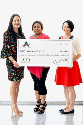 ACE Cash Express employees present their donation to Kevin McQuhae, Executive Director for Back on My Feet Los Angeles