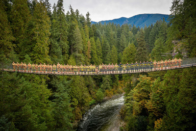 40 fire fighters from across the Lower Mainland gather on the iconic Capilano Suspension Bridge in honour of BC Proffesional Fire Fighters' Burn Fund's 40th anniversary. (CNW Group/British Columbia Professional Fire Fighters Burn Fund)