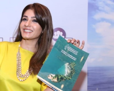 Raveena Tandon displays Dominica's Citizenship by Investment brochure (PRNewsfoto/CS Global Partners)