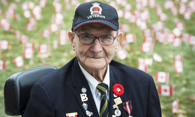 Second World War Veteran Don Stewart (92) surrounded by a patriotic sea of Canadian flags at the Sunnybrook Veterans Centre. Operation Raise a Flag returns to the country's largest Veterans' care facility with 47,500 Canadian flags planted around the campus in honour of Remembrance Day. All Canadians are encouraged to send a note of thanks and a donation to support the war heroes living at the Sunnybrook Veterans Centre. (CNW Group/Sunnybrook Health Sciences Centre)