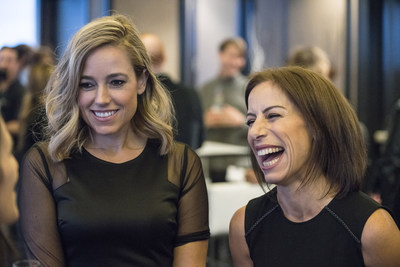 Technology reporter Amber Mac, left, and Jodie Wallis, Managing Director of Accenture's AI practice in Canada, co-hosts of the number one Canadian business news podcast, "The AI Effect", talk with guests at a Season 2 launch party in Toronto, Ont. on Wednesday, October 24, 2018.  THE CANADIAN PRESS IMAGES/J.P. Moczulski (CNW Group/Accenture)