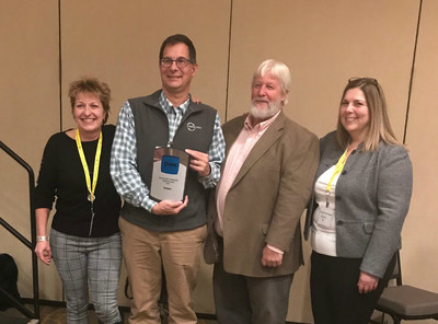 PaitCare's Laura Honis (CT/RI state manager), John Hurd (VT/ME state manager), and Marjaneh Zarrehparvar (Executive Director) accept the Northeast Recycling Council's 2018 Environmental Sustainability Leadership Award, along with Connecticut State Senator Craig Miner.