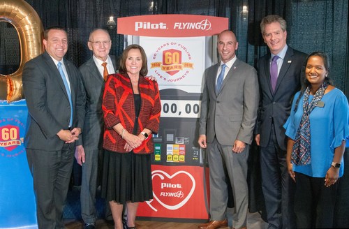 In celebration of its 60th anniversary, Pilot Flying J announced donations totaling $2 million at a Nov. 1 presentation at the company’s HQ in Knoxville.  More than 20 nonprofit organizations will receive contributions. Pictured from left: Bart McFadden (Boys & Girls Clubs); Pilot Flying J Founder James A. Haslam II; Elaine Streno (Second Harvest Food Bank of East Tennessee); Nathan Smith (Hire Heroes USA); Andy Wilson (Feeding America); and Meg Counts (Pilot Flying J).