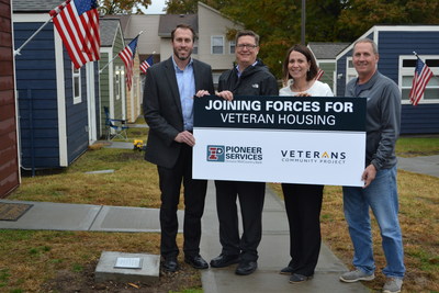 Jodi Vickery (second from right), President of Pioneer Services, recently presented a check for $50,000 to the Veterans Community Project to provide transitional 