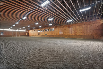 The indoor riding arena measures 80-ft x 140-ft, and is perfect for exercising horses during inclement weather. An outdoor arena is also on-site. NewYorkLuxuryAuction.com.